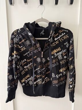 bebe Black Zip Hoodie with Gold & White City Script